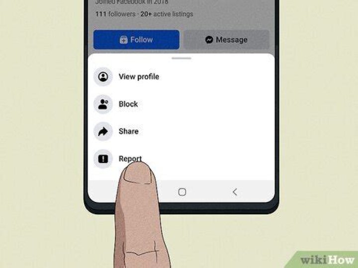How do I contact Facebook about a scammer?