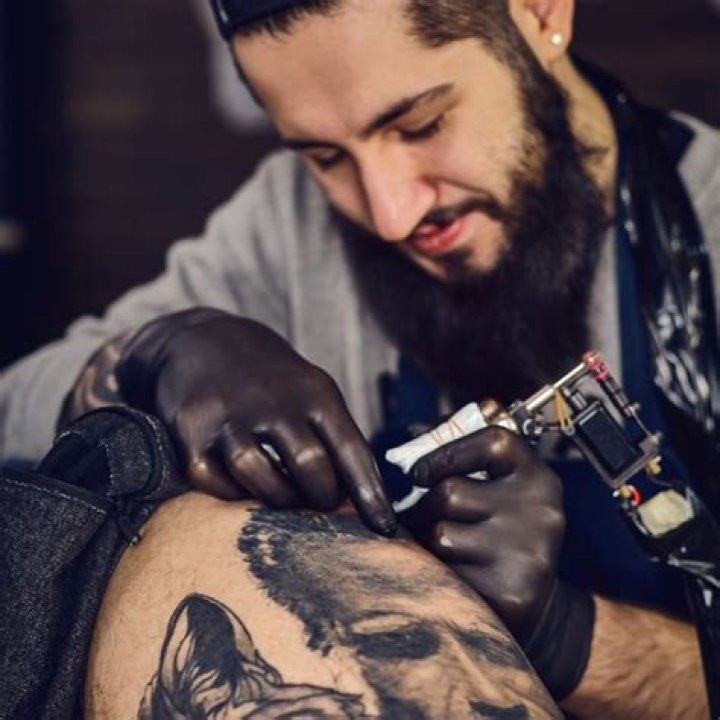 How do I find a reputable tattoo artist?