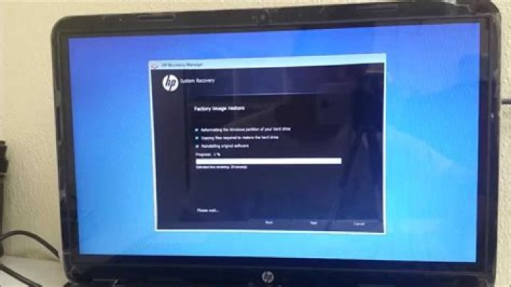 How do I restore my HP Touchsmart to factory settings?