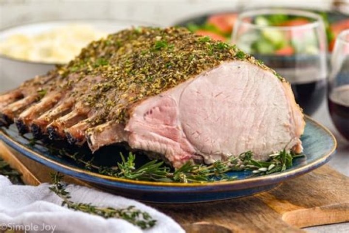 How long do you cook a bone in pork roast per pound?