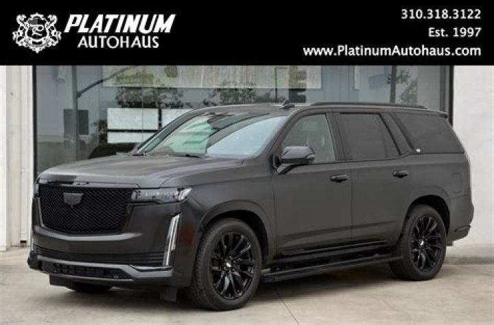 Is there a used Cadillac Escalade for sale by Mercedes?