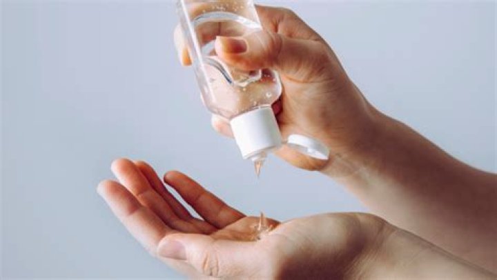 What are the guidelines for using hand sanitizer during COVID-19?
