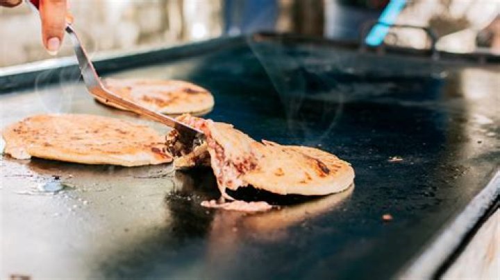 What do pupusas symbolize?