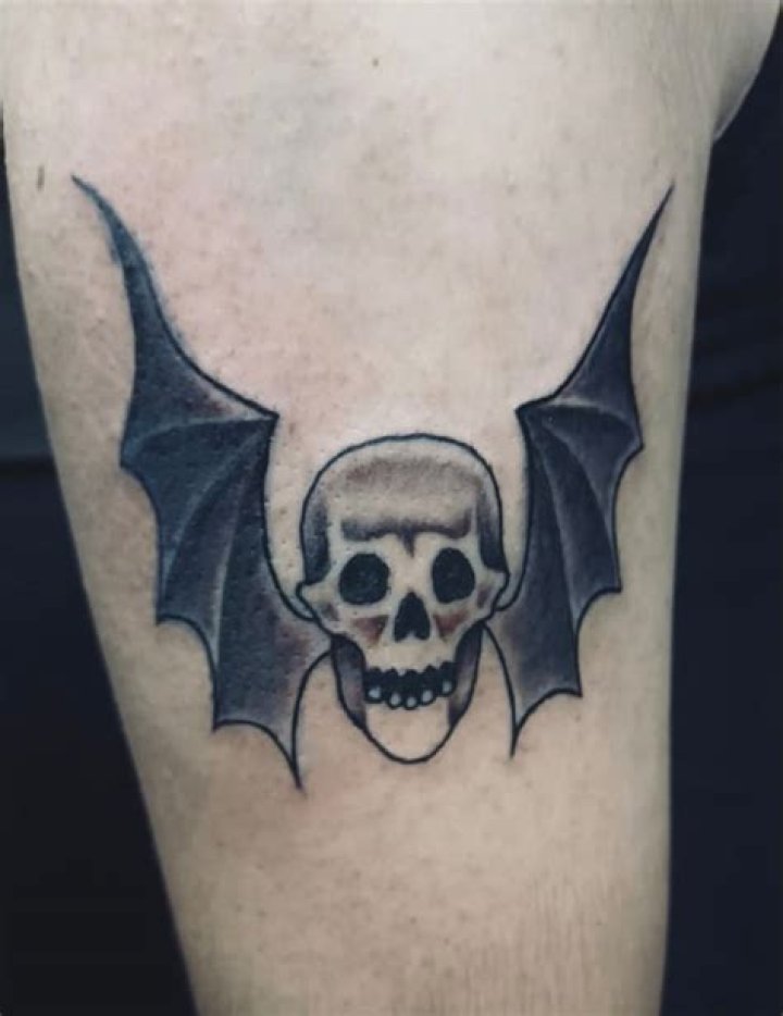 What does skull with bat wings tattoo mean?