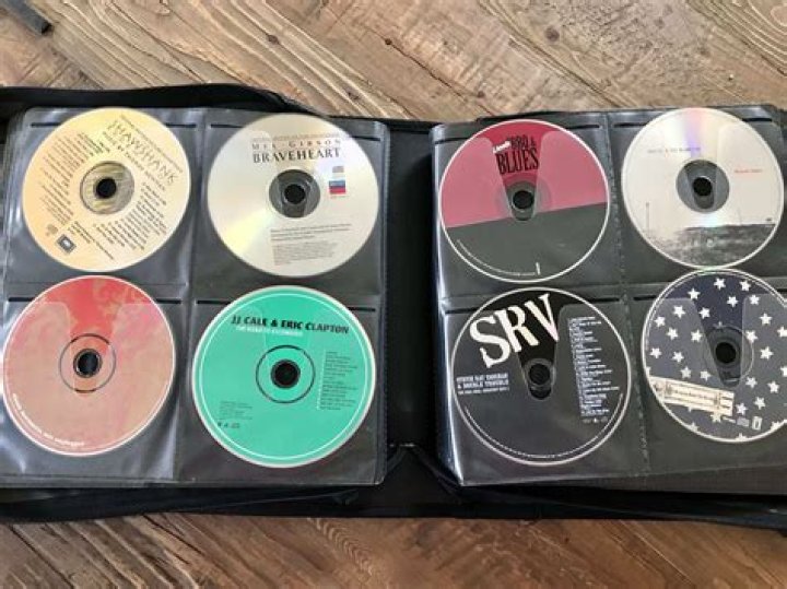What is the best way to store CDs and DVDs?