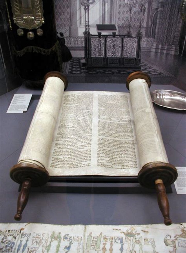 What is written in the Torah scroll?