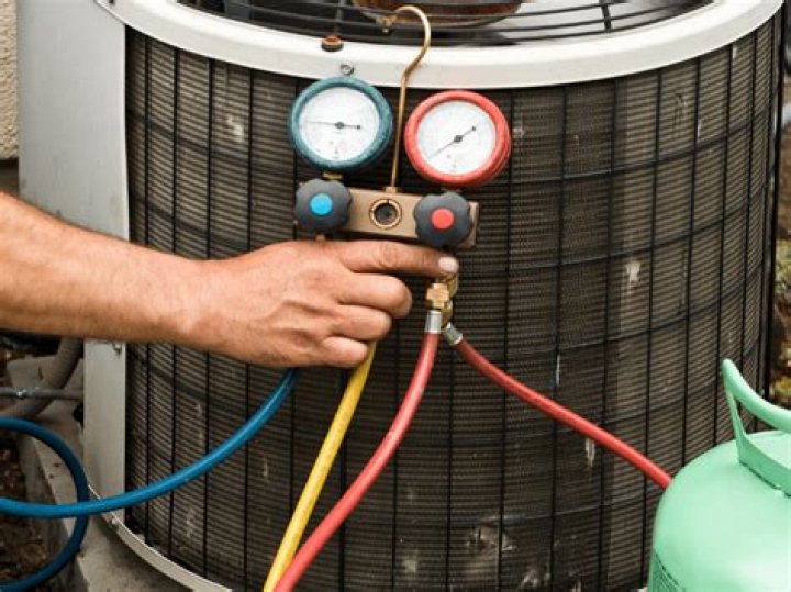 What type of refrigerant is used in residential air conditioners?