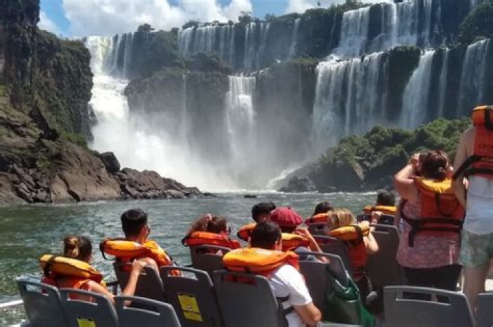 Where should I stay when visiting Iguazu Falls?
