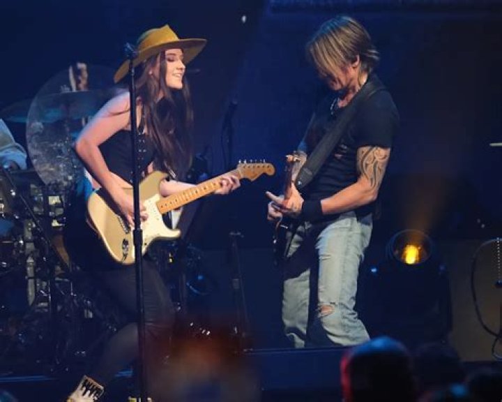 Who has toured with Keith Urban?